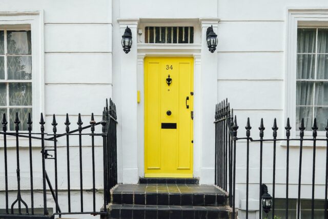 closed yellow door to a home